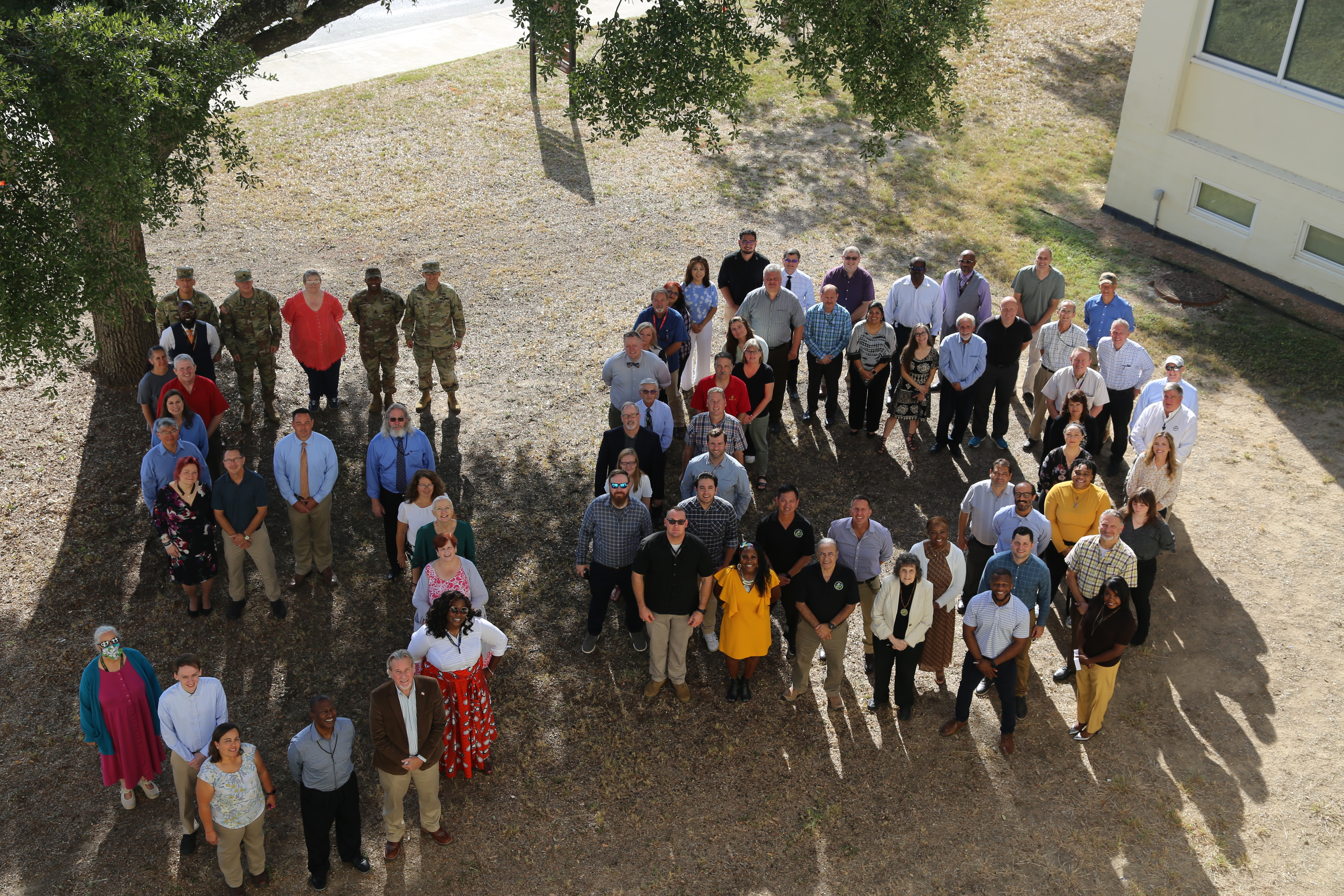 Photo taken in 2022 to commemorate the 50th anniversary of the command showing some  USAEC employees standing in a 5-0 formation.